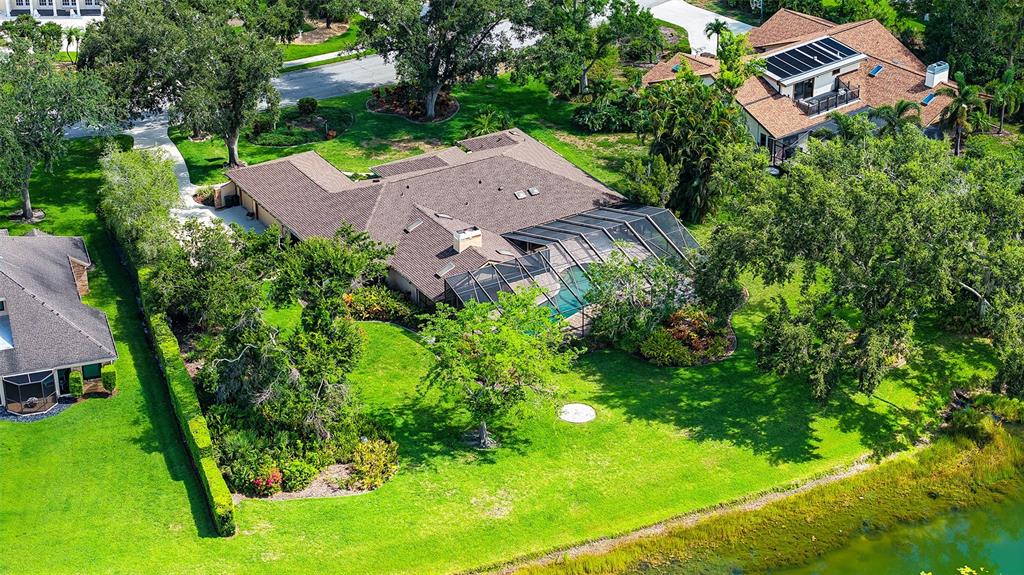 7426 Weeping Willow Boulevard Sarasota, FL 34241 - Photo 60 of 66 an aerial view of a house with garden space and street view