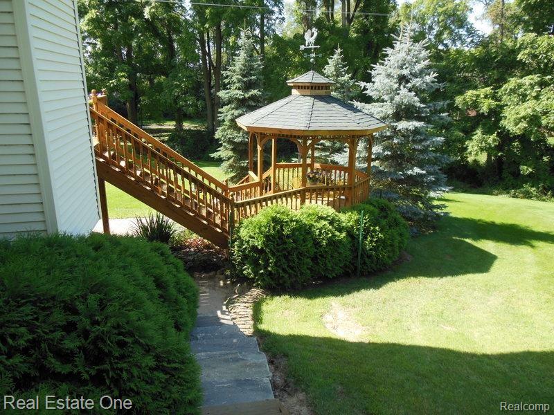 10155 Roberts Road Gregory, MI 48137 - Photo 78 of 89 From the wrap around porch Granite stairs to lower level paver patio.