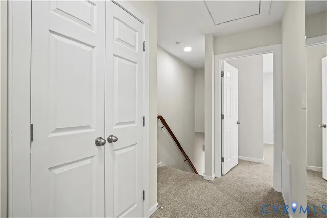 a view of a hallway with a door