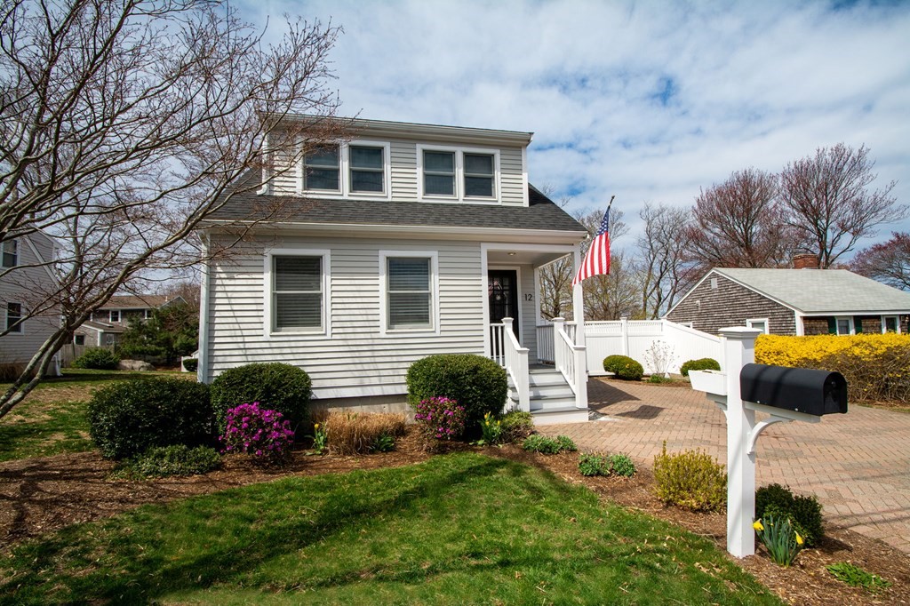 12 Hawley Road Scituate, MA 02066 - Photo 1 of 36 a front view of a house with a yard and garage