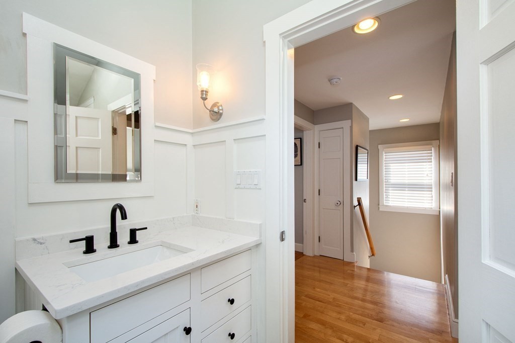 12 Hawley Road Scituate, MA 02066 - Photo 21 of 36 a bathroom with a sink and a mirror