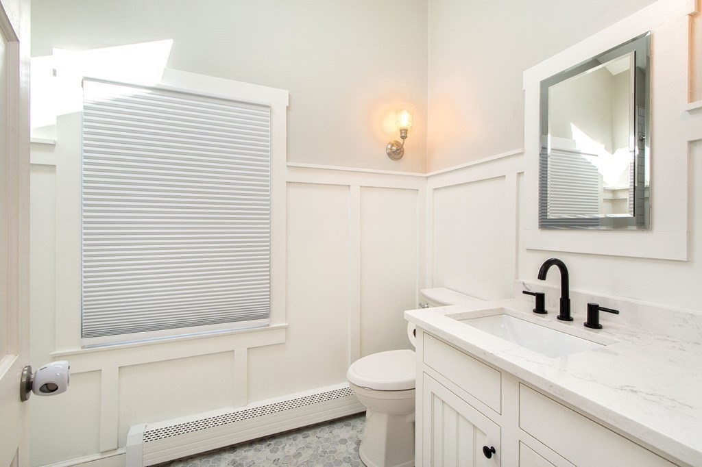 12 Hawley Road Scituate, MA 02066 - Photo 22 of 36 a bathroom with a sink a toilet and shower
