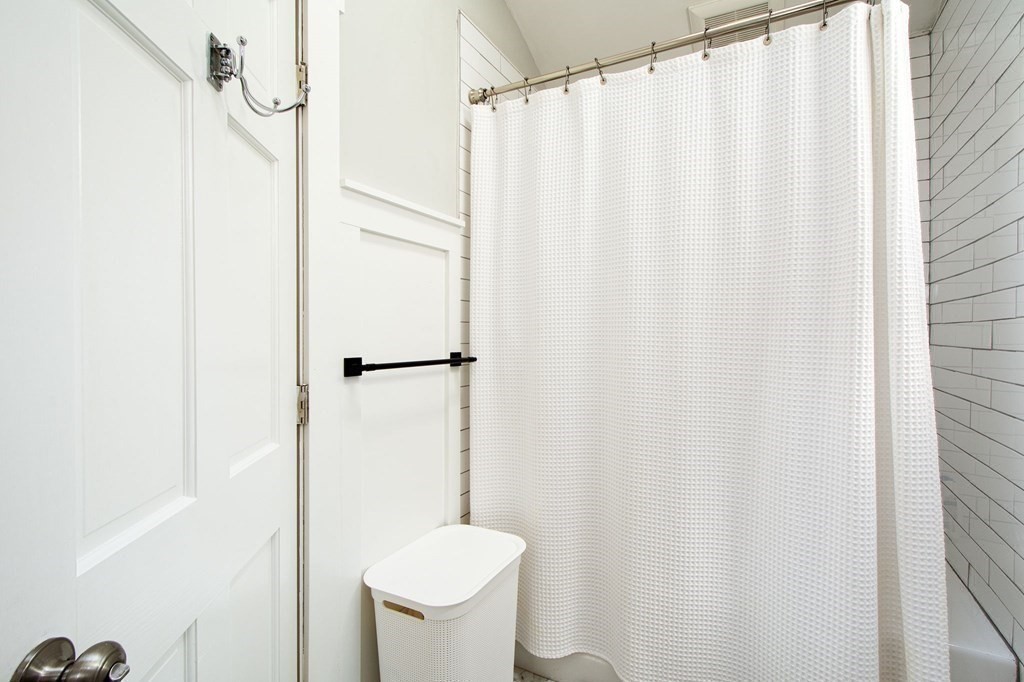 12 Hawley Road Scituate, MA 02066 - Photo 23 of 36 a bathroom with a shower curtain and sink