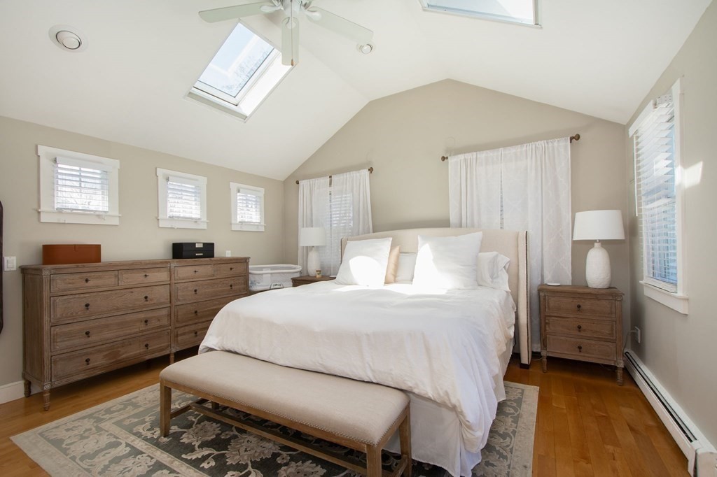 12 Hawley Road Scituate, MA 02066 - Photo 25 of 36 a bedroom with a bed and wooden floor