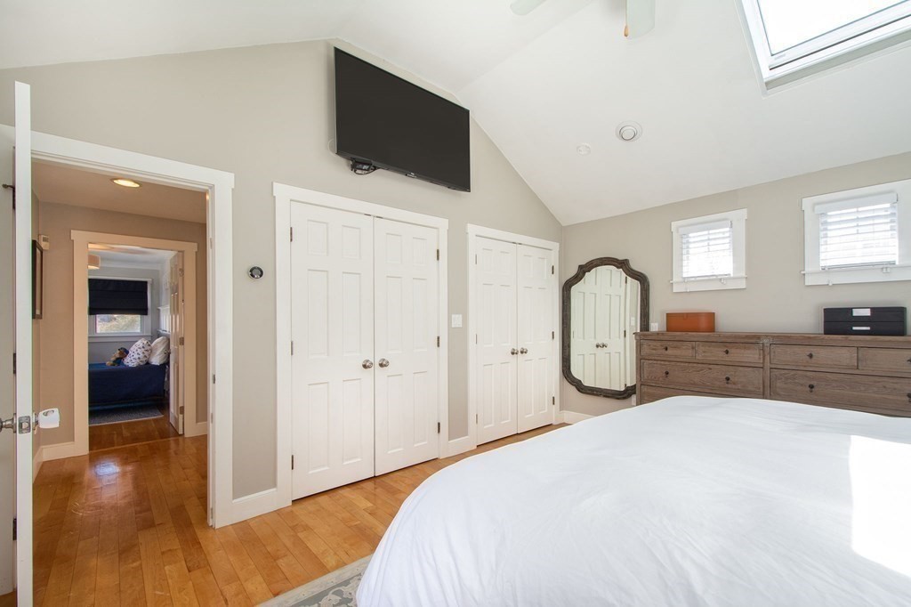 12 Hawley Road Scituate, MA 02066 - Photo 26 of 36 a spacious bedroom with a bed and a flat screen tv