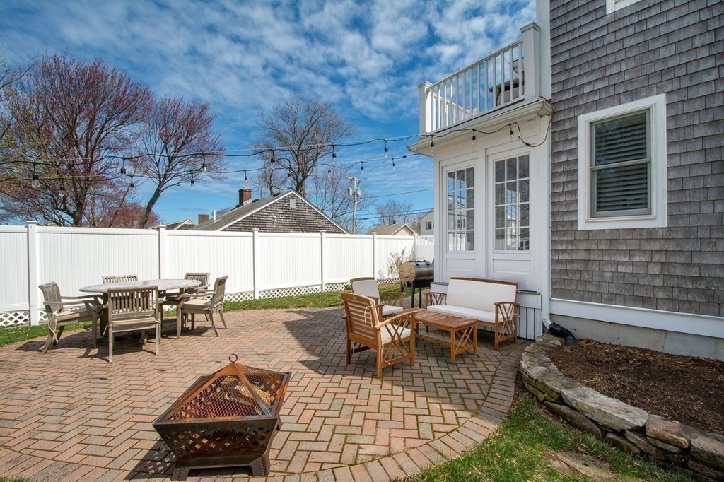 12 Hawley Road Scituate, MA 02066 - Photo 34 of 36 a view of a patio with dining table and chairs with wooden floor