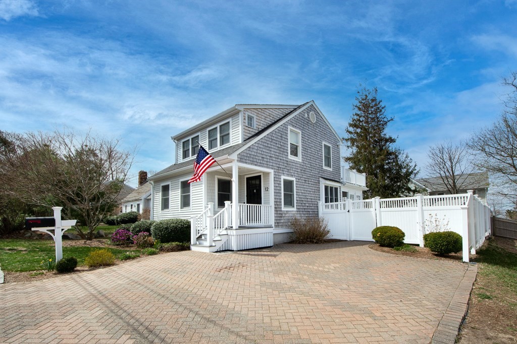 12 Hawley Road Scituate, MA 02066 - Photo 4 of 36 a front view of house with yard and trees in the background