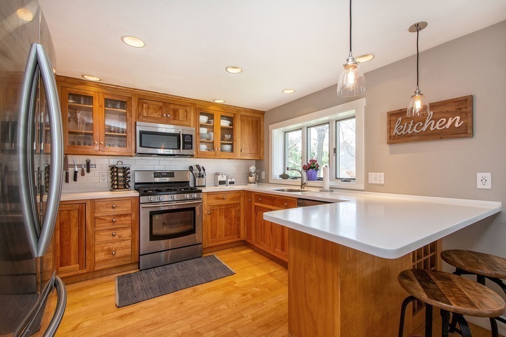 12 Hawley Road Scituate, MA 02066 - Photo 10 of 36 a kitchen with stainless steel appliances granite countertop a sink stove and refrigerator