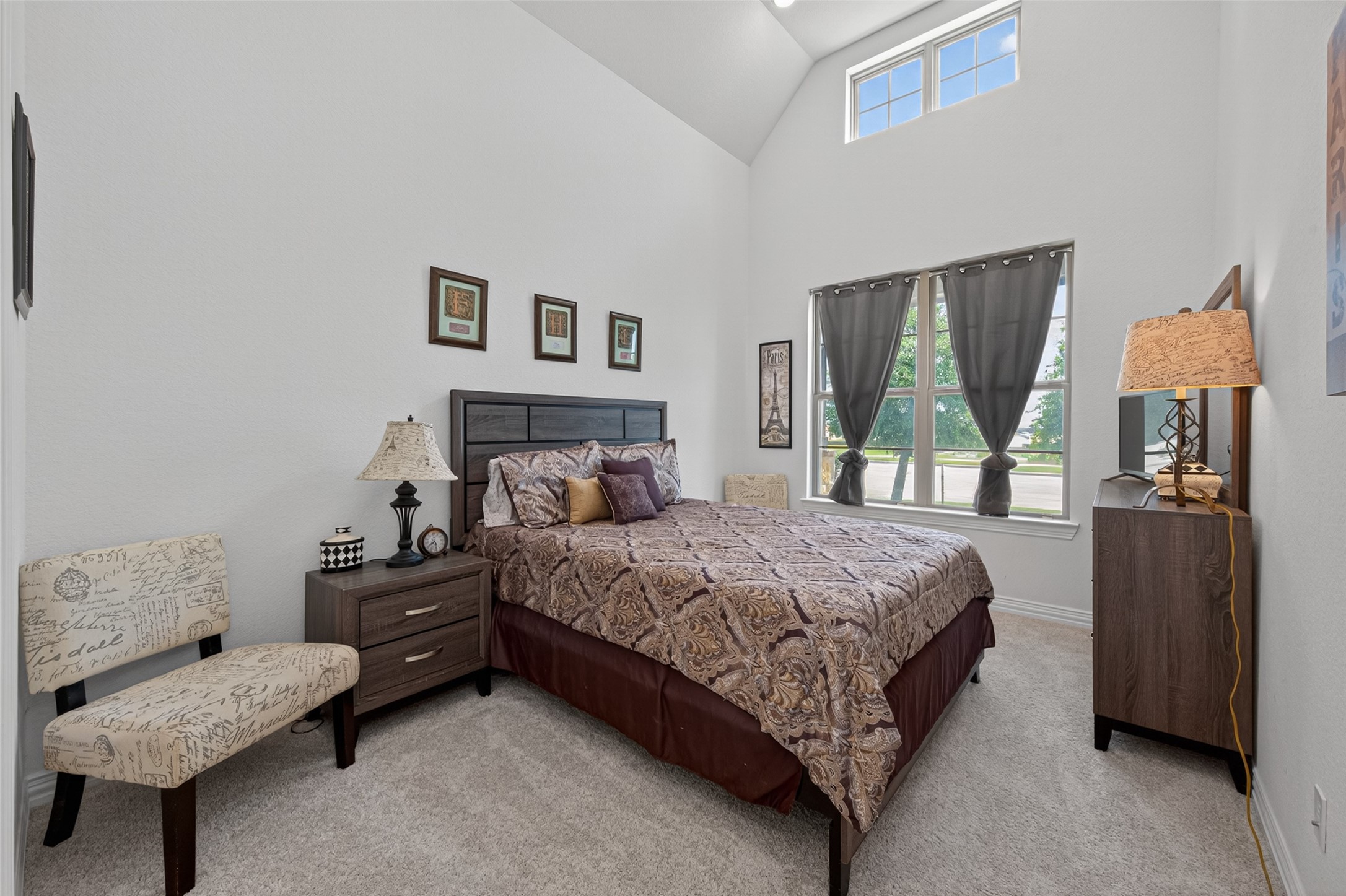 20802 Mirror Point Drive Cypress, TX 77433 - Photo 23 of 37 This comfortable bedroom features high ceilings, large windows, and a soothing, inviting ambiance. The space offers a peaceful retreat with ample natural light, perfect for restful nights and rejuvenating mornings, providing a tranquil escape.
