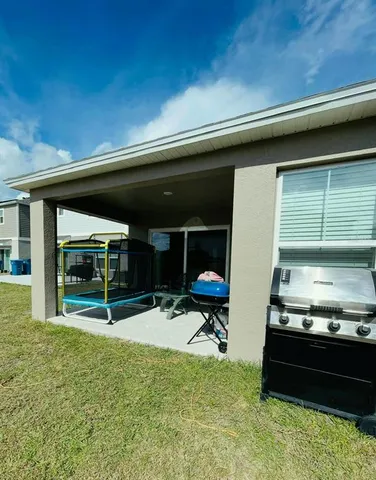 a view of a two chairs in the patio