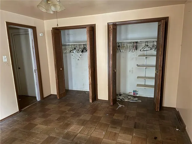 wooden floor with a bathroom