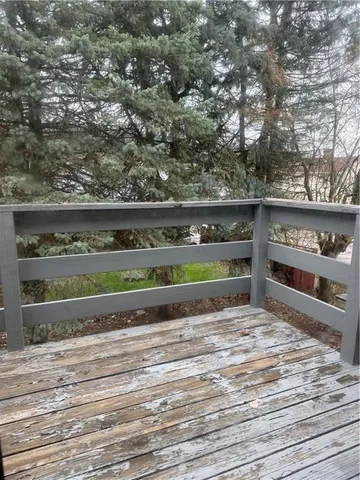 a view of a street with a barn