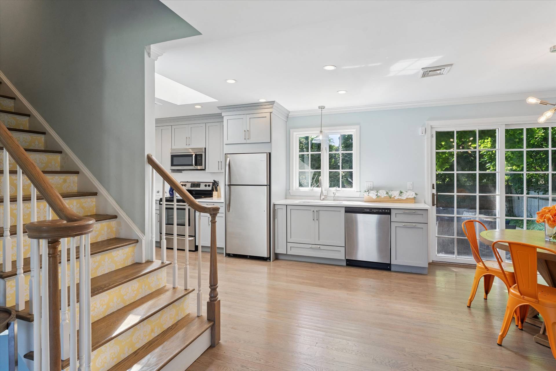 19 Maple Street Westhampton Beach, NY 11978 - Photo 5 of 23 a kitchen with stainless steel appliances kitchen island granite countertop a refrigerator and a sink