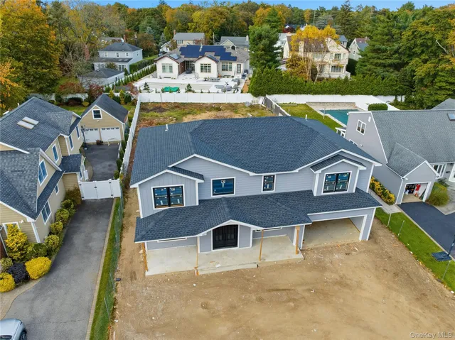 an aerial view of a house with a big yard