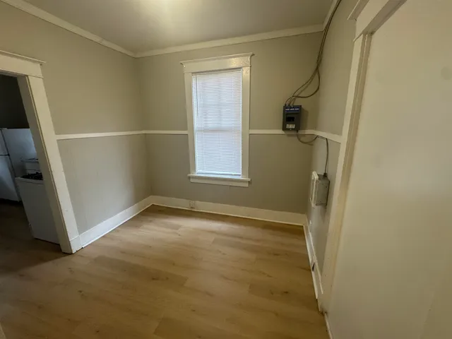 a kitchen with wooden cabinets and a stove top oven