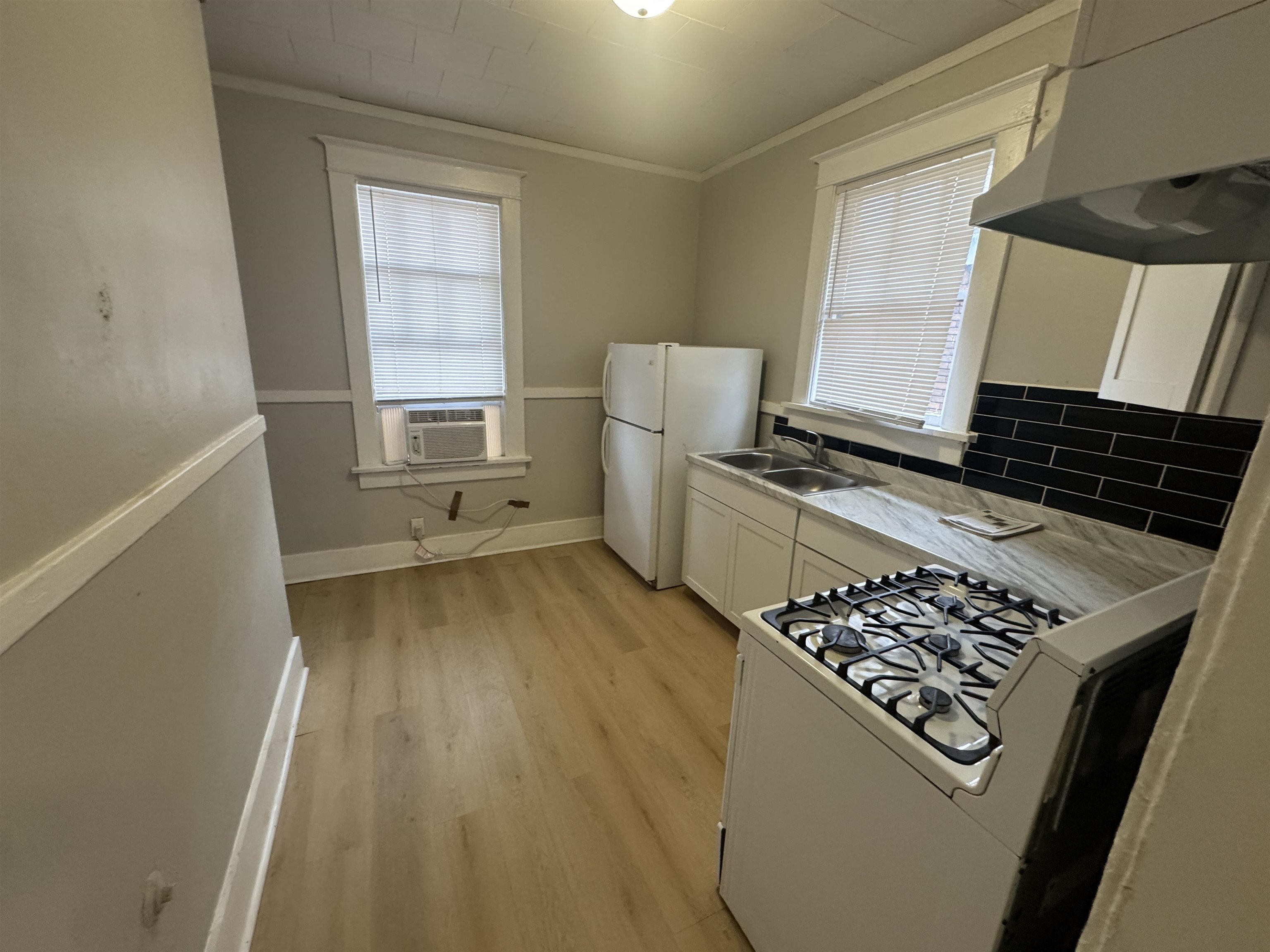 2012 Carnes Avenue Memphis, TN 38114 - Photo 16 of 28 a kitchen with wooden cabinets and a stove top oven