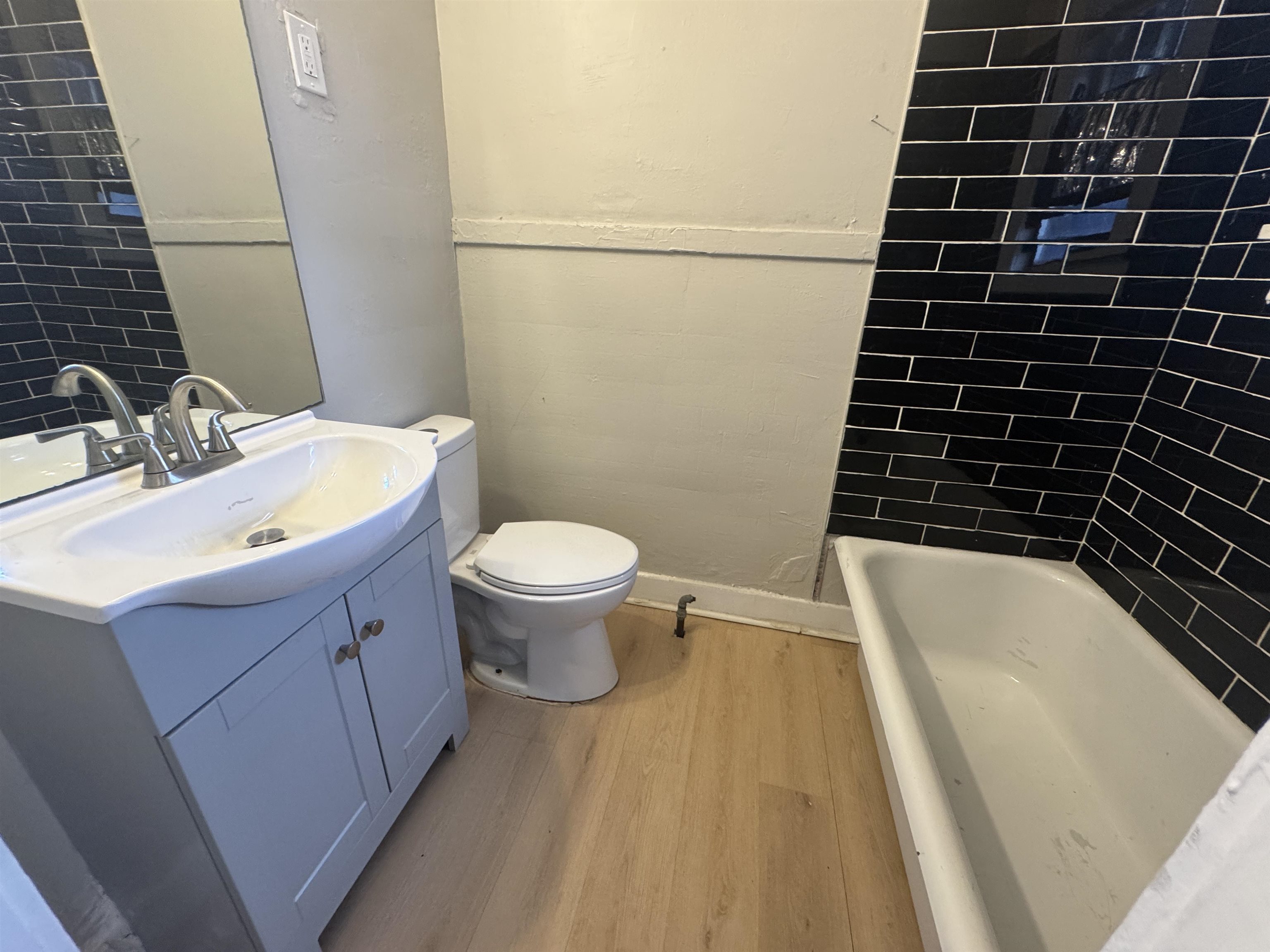 2012 Carnes Avenue Memphis, TN 38114 - Photo 19 of 28 a bathroom with a sink a toilet a mirror and shower