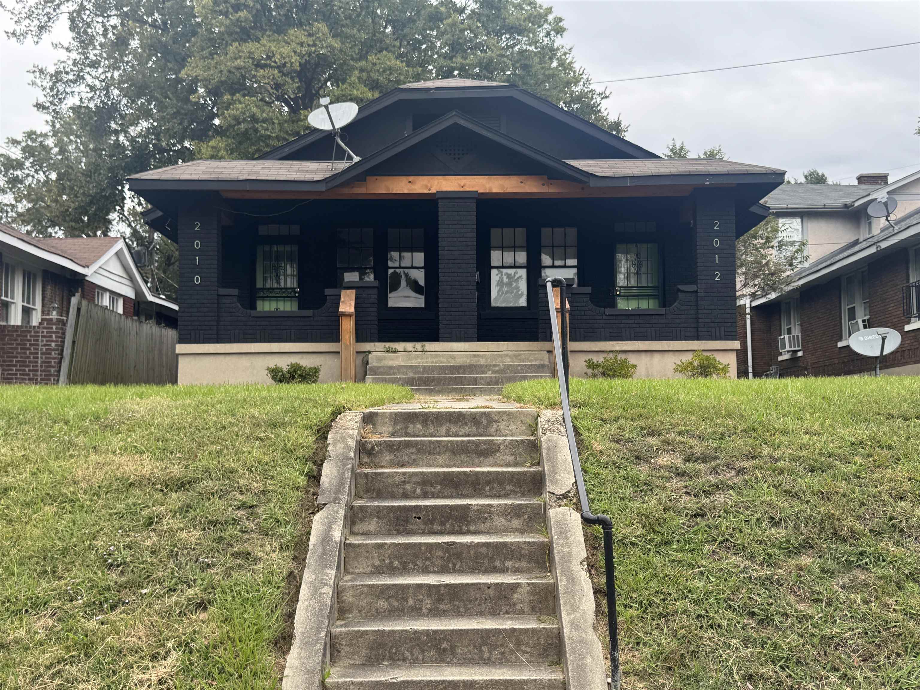 2012 Carnes Avenue Memphis, TN 38114 - Photo 2 of 28 a front view of a house with a yard