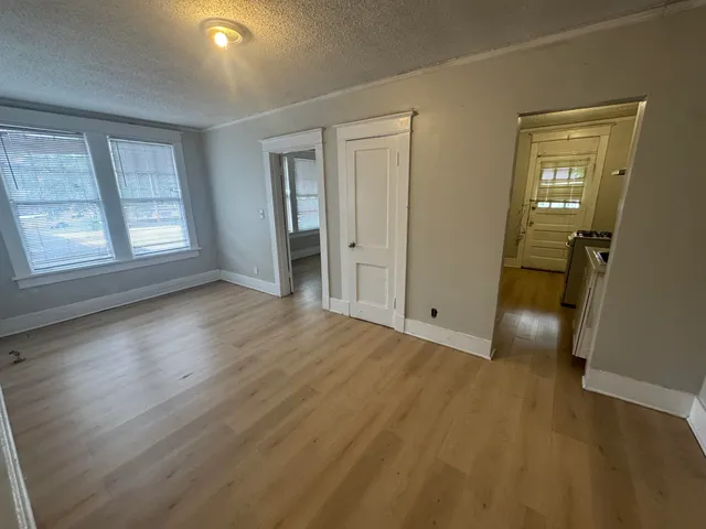 a kitchen with a stove and a refrigerator