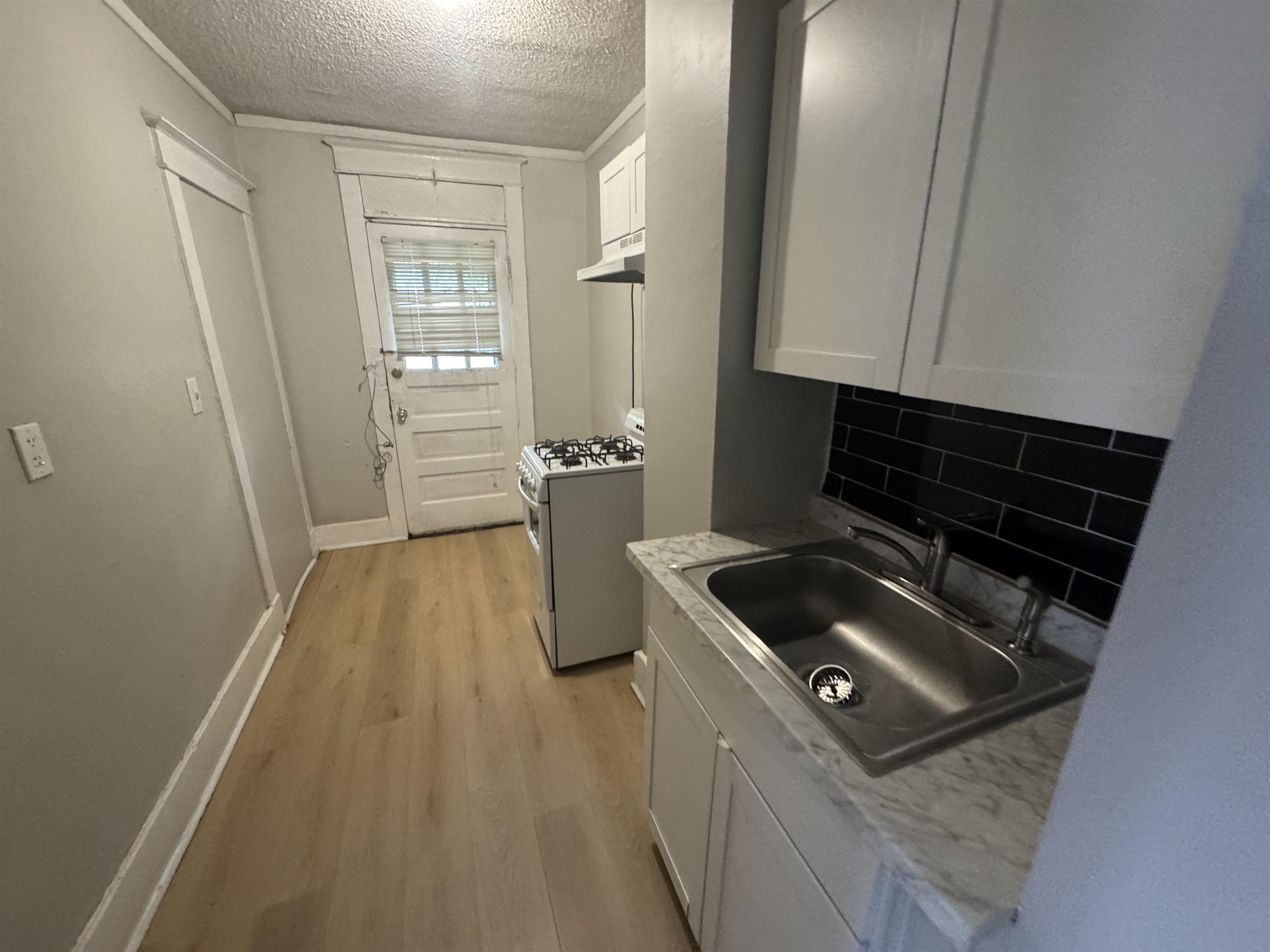 2012 Carnes Avenue Memphis, TN 38114 - Photo 23 of 28 a kitchen with a stove and a refrigerator