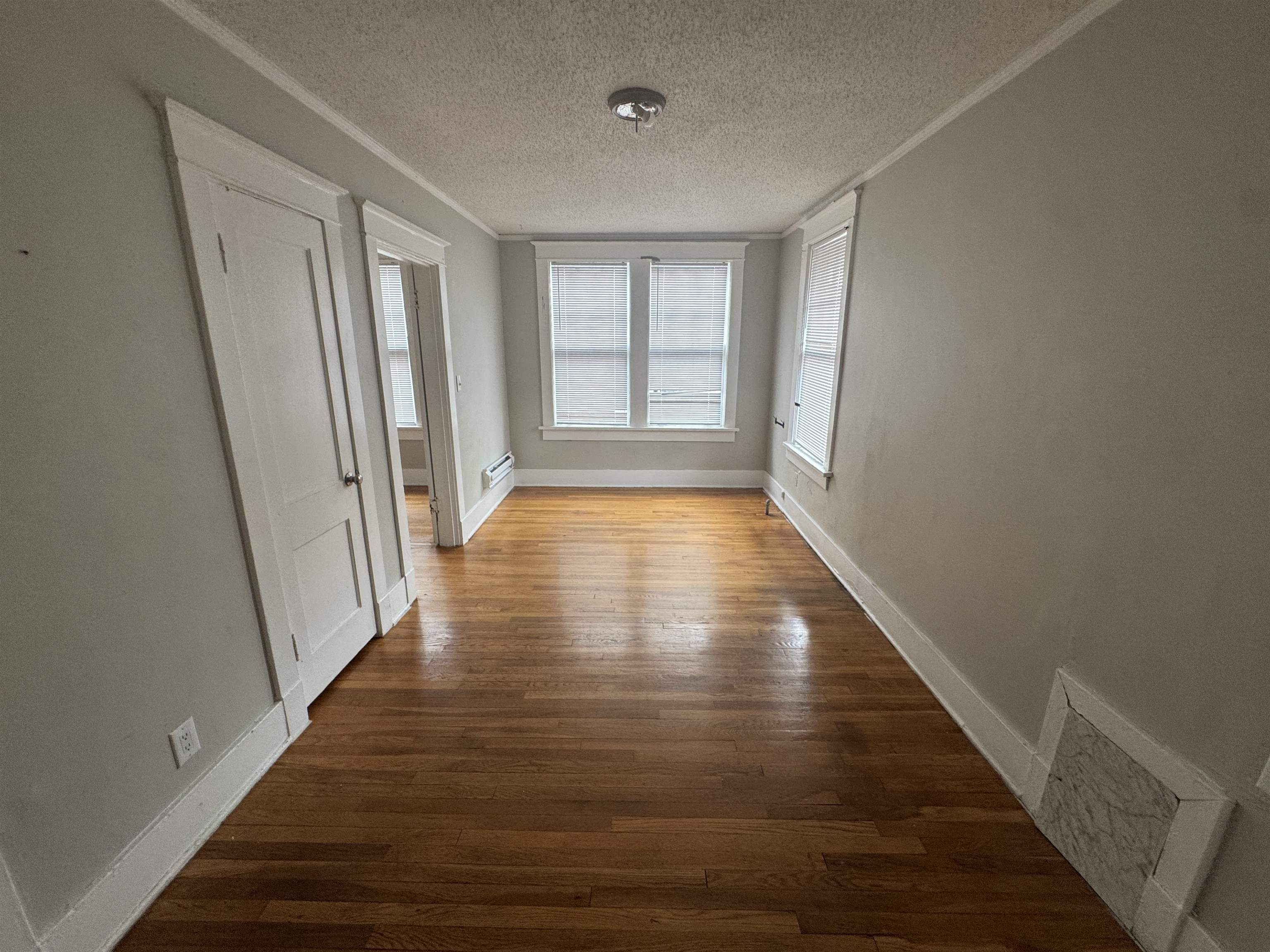 2012 Carnes Avenue Memphis, TN 38114 - Photo 26 of 28 a view of an empty room with wooden floor and a window