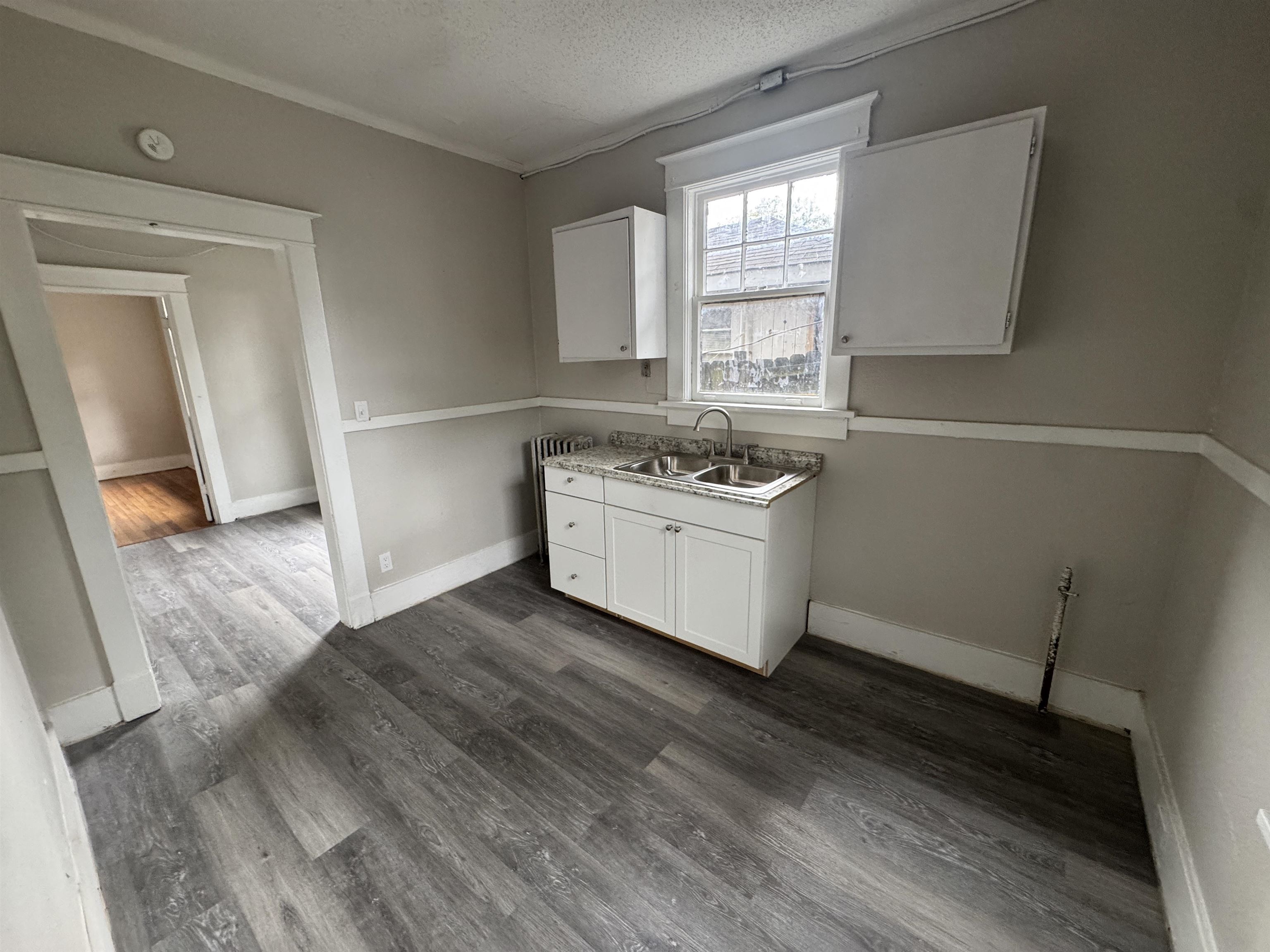 2012 Carnes Avenue Memphis, TN 38114 - Photo 6 of 28 a kitchen with a stove a sink and a window