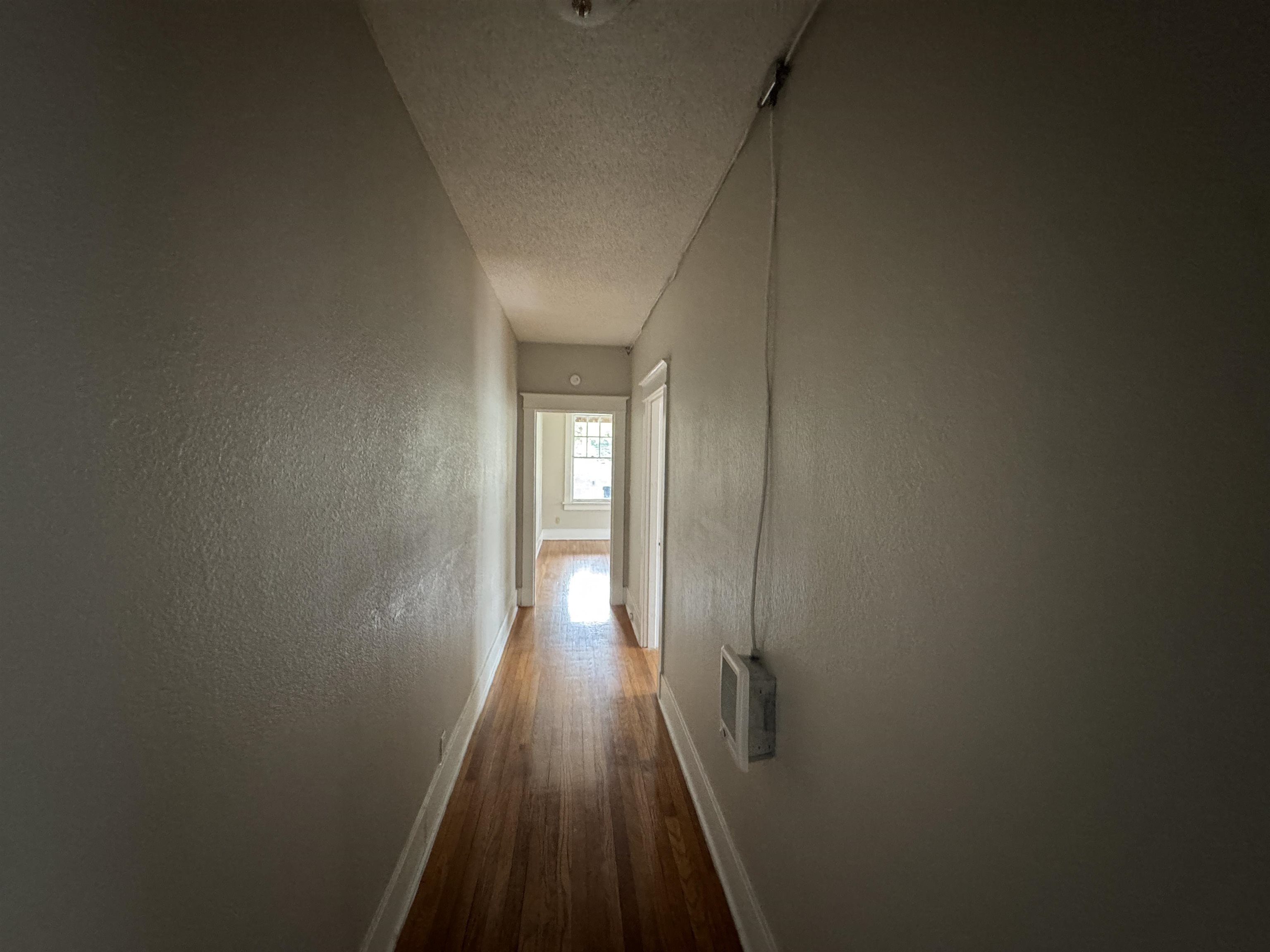 2012 Carnes Avenue Memphis, TN 38114 - Photo 7 of 28 a view of a hallway with wooden floor
