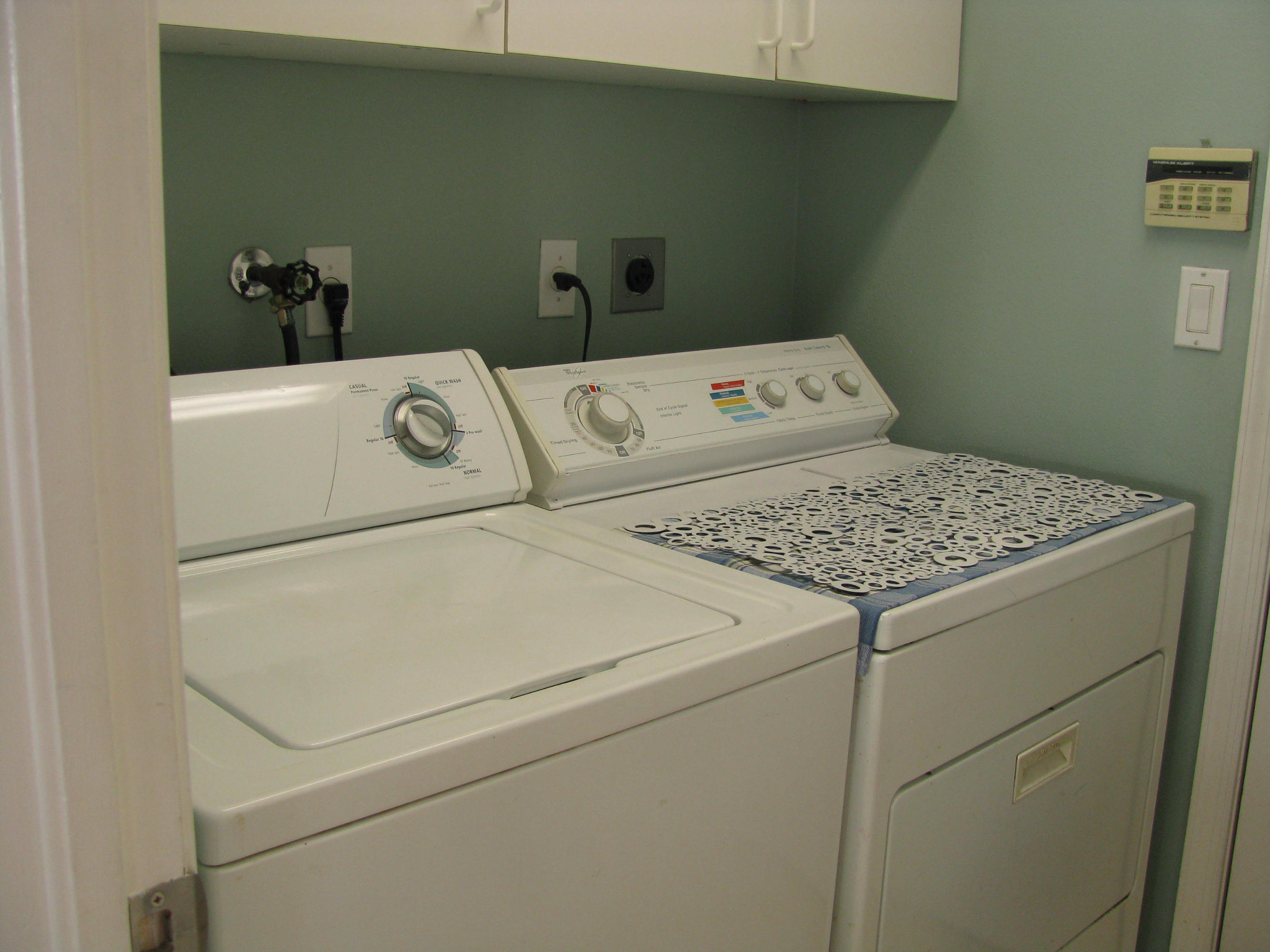103 Waterbridge Lane Jupiter, FL 33458 - Photo 25 of 47 a close up of a washer and dryer
