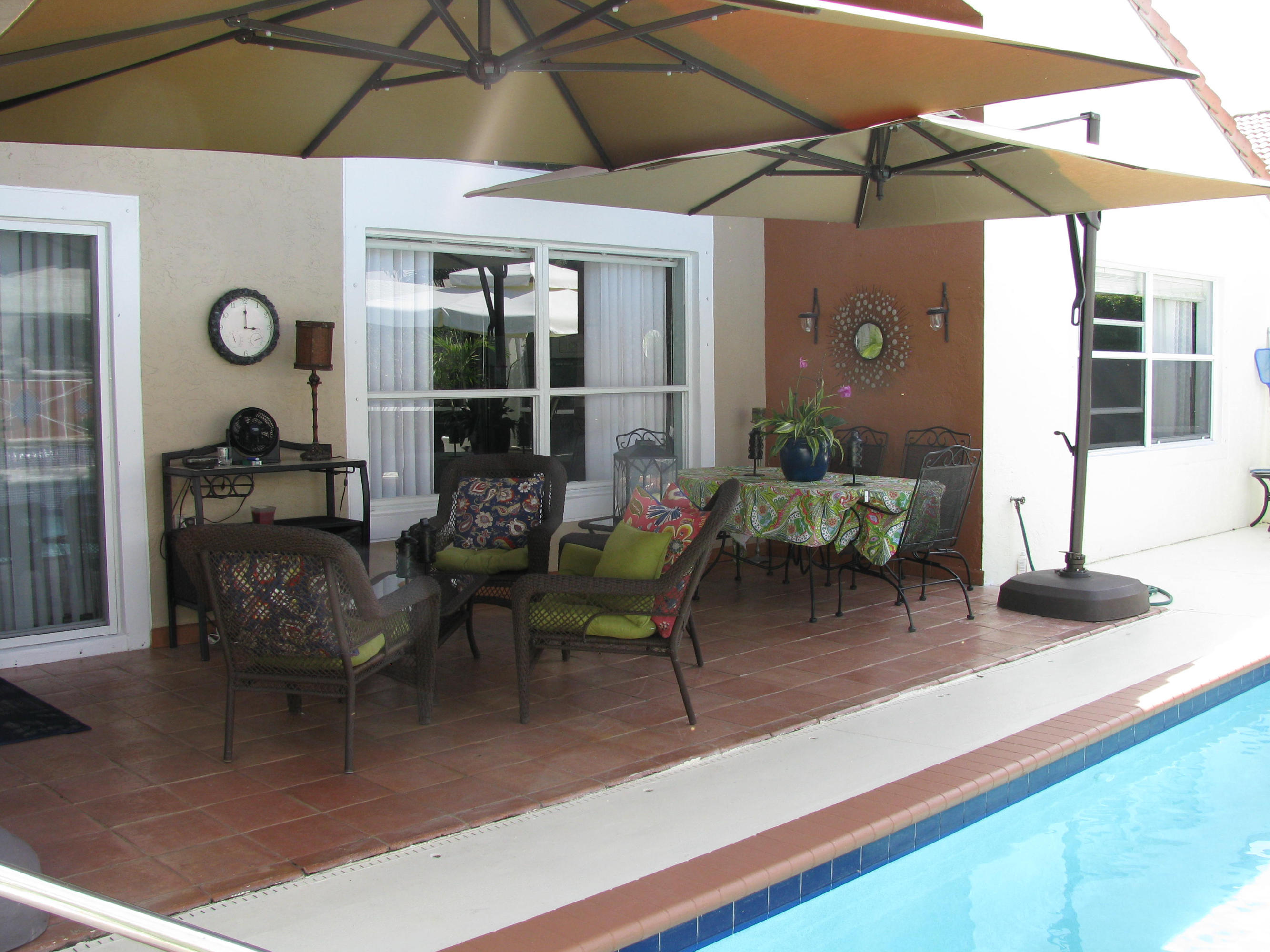 103 Waterbridge Lane Jupiter, FL 33458 - Photo 29 of 47 a living room with furniture and a window