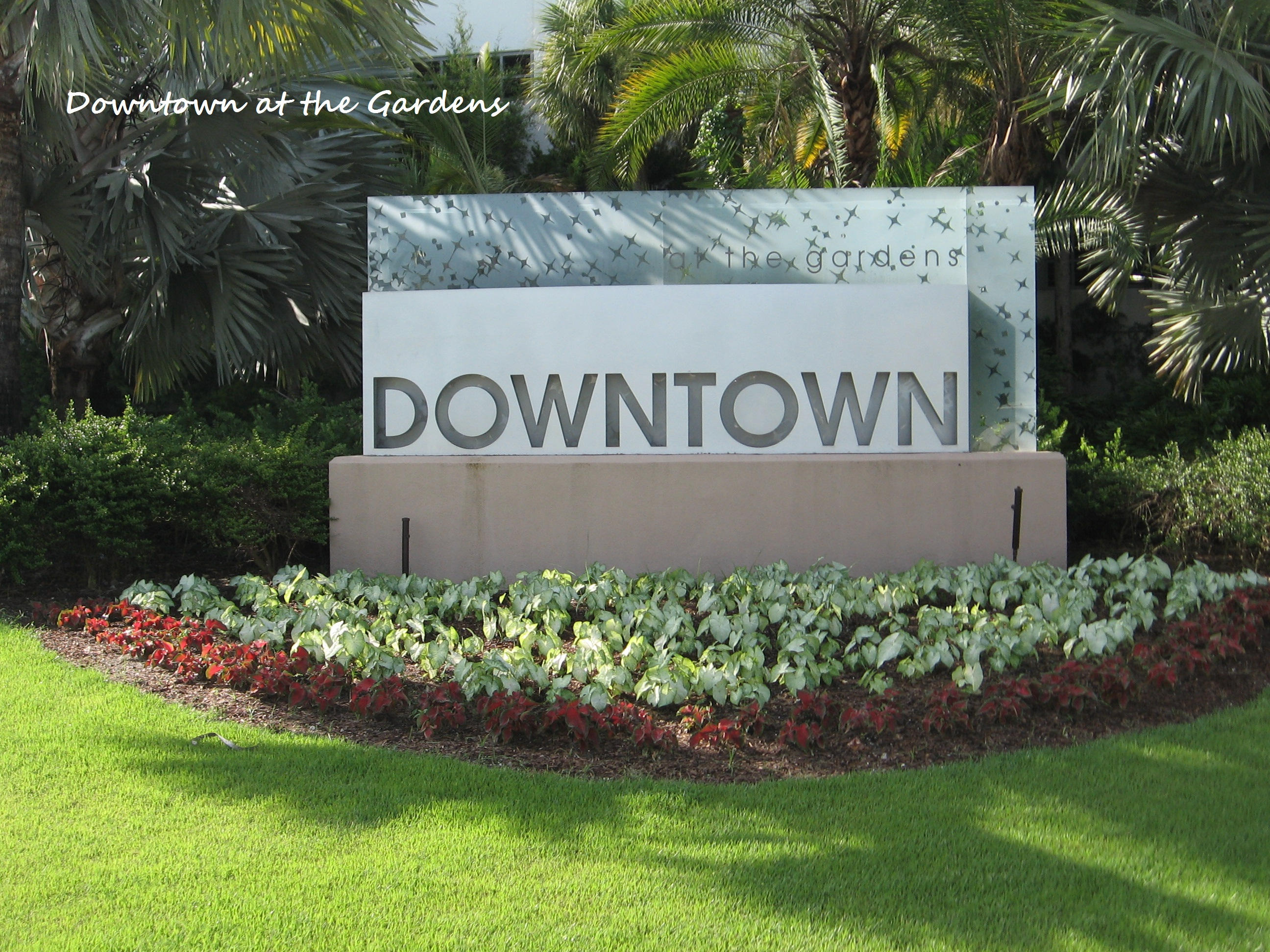 103 Waterbridge Lane Jupiter, FL 33458 - Photo 44 of 47 a street sign that is sitting in the grass