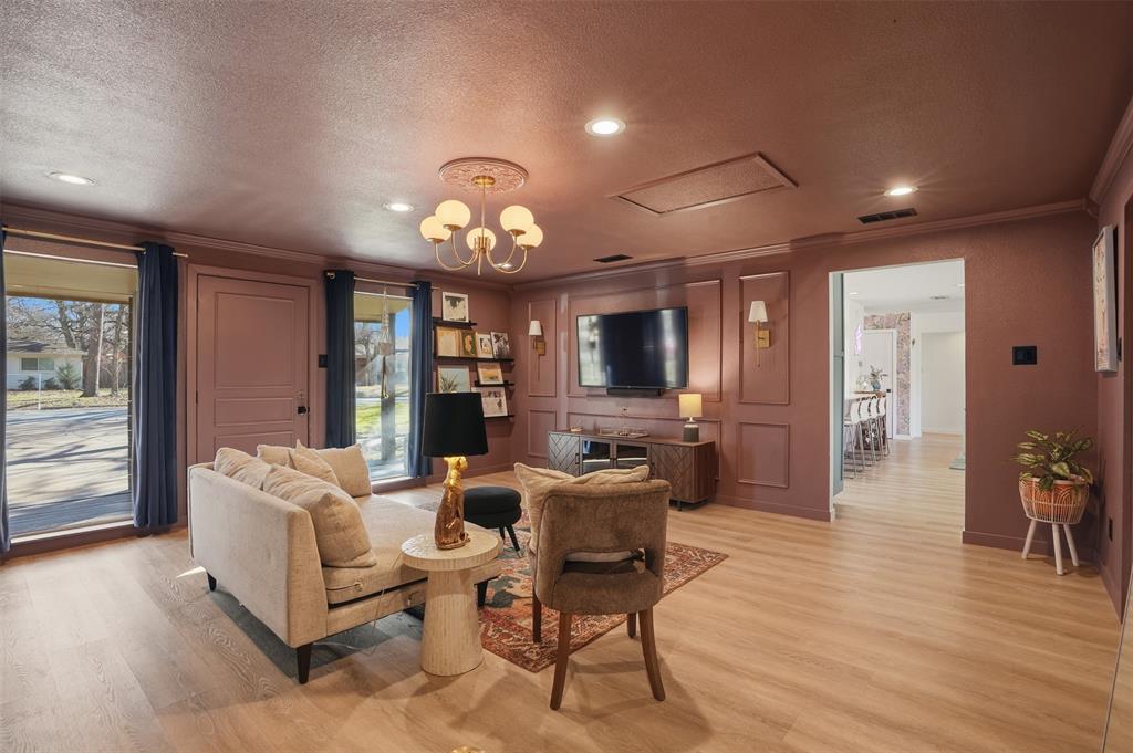 1008 Ridgewood Terrace Arlington, TX 76012 - Photo 13 of 40 a living room with furniture potted plant and a flat screen tv