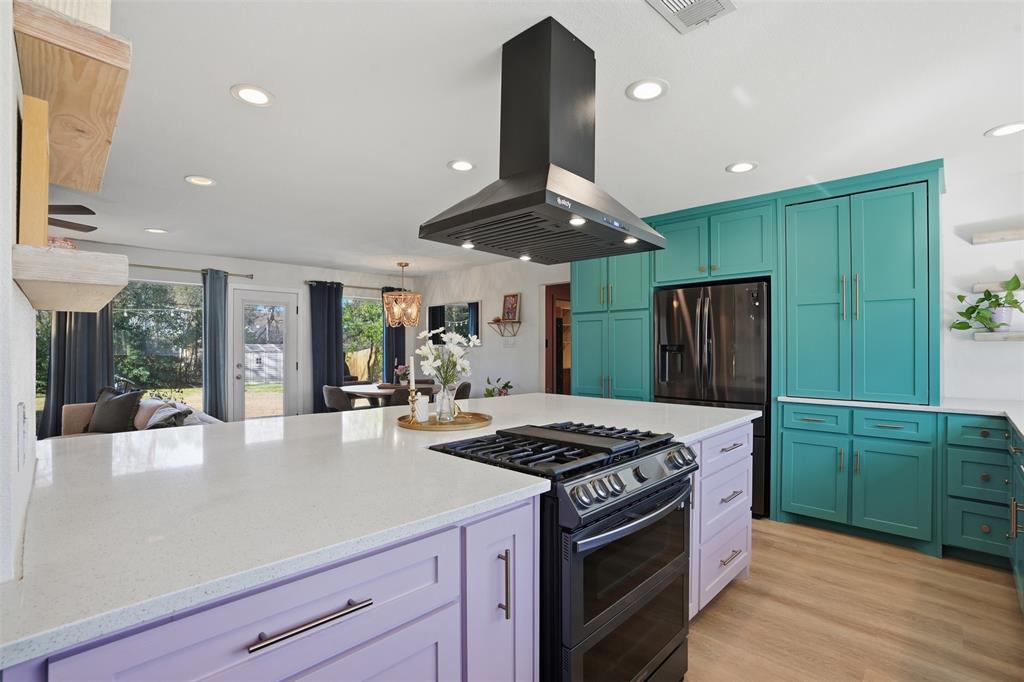 1008 Ridgewood Terrace Arlington, TX 76012 - Photo 16 of 40 a kitchen with stainless steel appliances granite countertop a sink a stove and a refrigerator