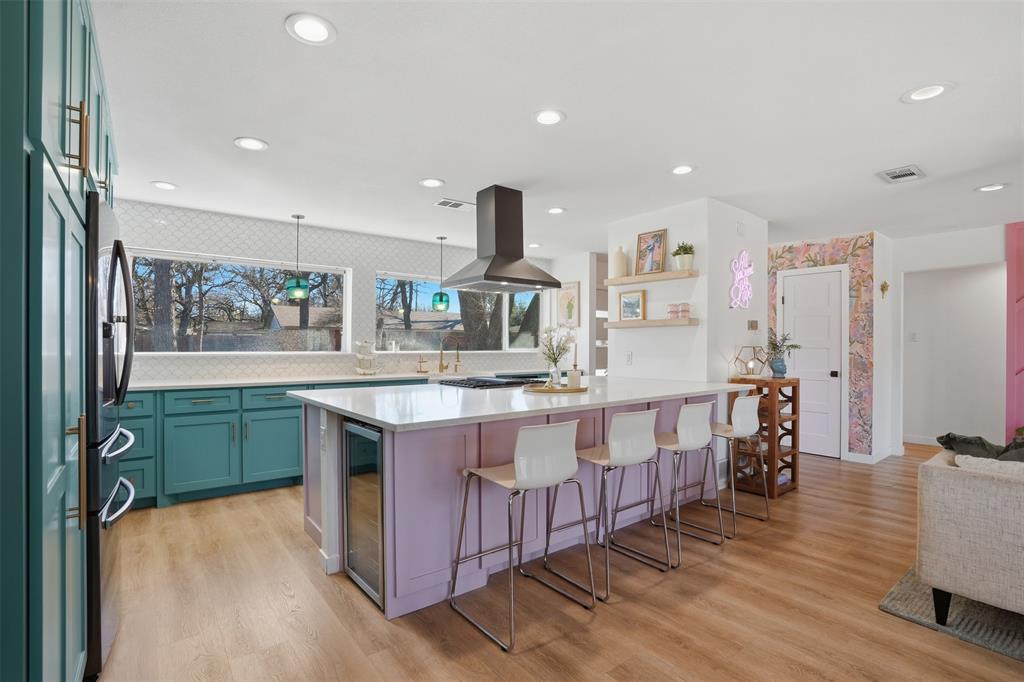 1008 Ridgewood Terrace Arlington, TX 76012 - Photo 17 of 40 a kitchen with stainless steel appliances granite countertop a sink and stove