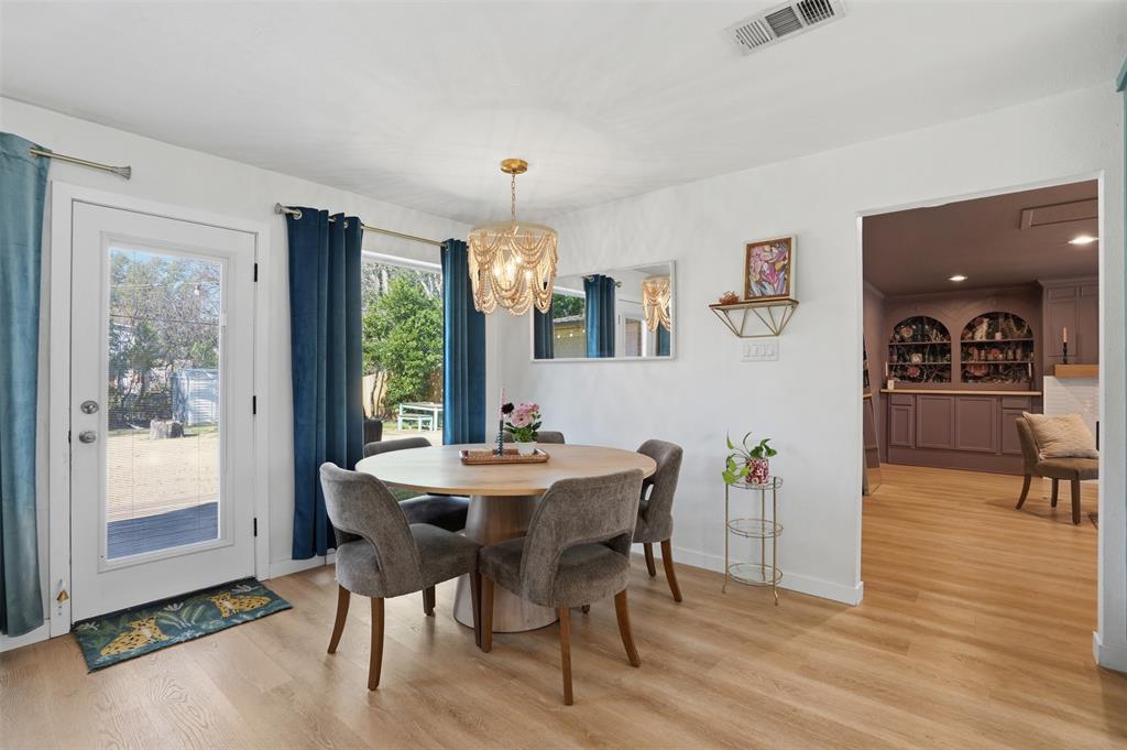 1008 Ridgewood Terrace Arlington, TX 76012 - Photo 19 of 40 a view of a dining room with furniture window and wooden floor