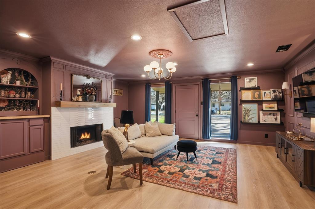 1008 Ridgewood Terrace Arlington, TX 76012 - Photo 4 of 40 a living room with furniture and a fireplace