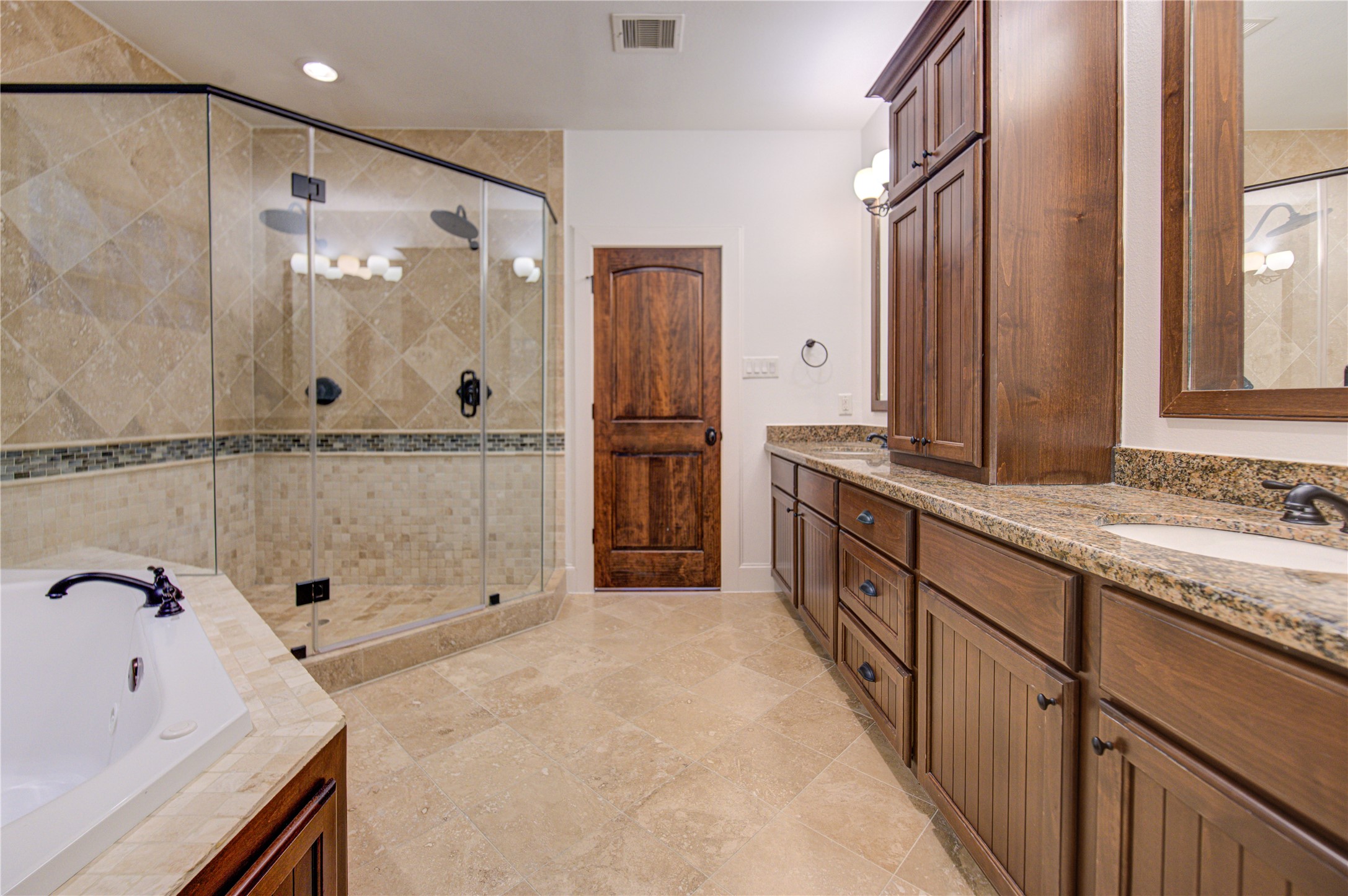 6520 Rodrigo Street Houston, TX 77007 - Photo 22 of 44 Spacious primary bath with dual vanities, soaking tub, oversized shower, and abundant cabinetry.
