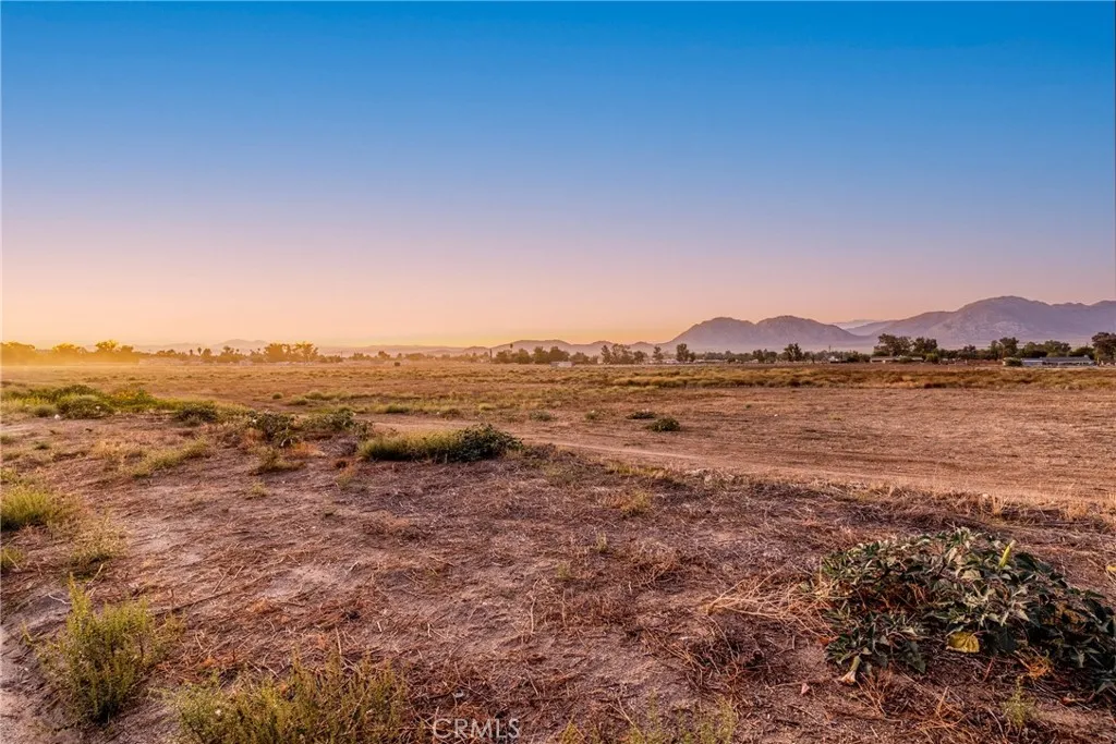 0 Montgomery Avenue Nuevo, CA 92567 - Photo 1 of 11 a view of a lake with mountains in the background