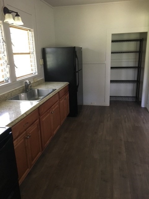 17-304 Volcano Road Kurtistown, HI 96749 - Photo 3 of 13 a kitchen with a sink and a refrigerator
