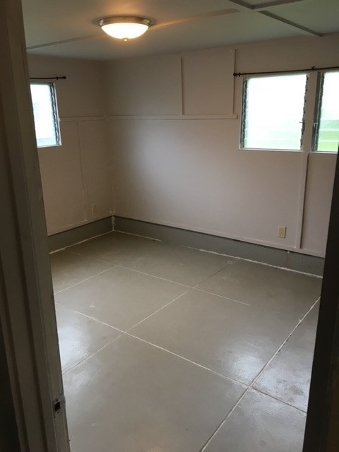 17-304 Volcano Road Kurtistown, HI 96749 - Photo 9 of 13 a view of an empty room with a window