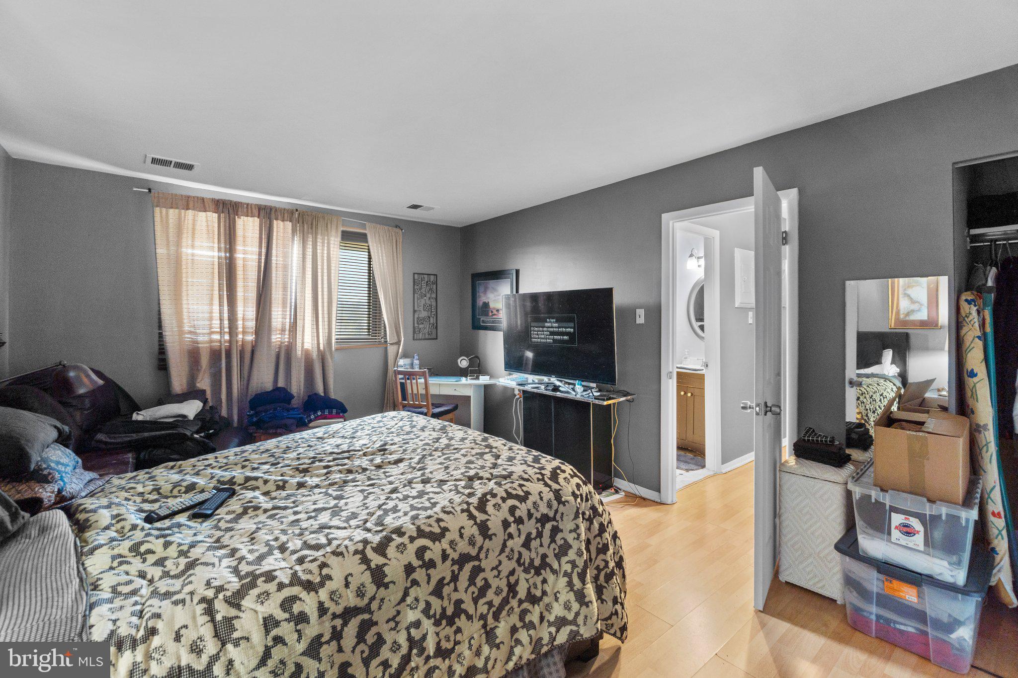 3928 Rolling Rd., Unit C9 Pikesville, MD 21208 - Photo 20 of 23 a bedroom with a bed and large windows