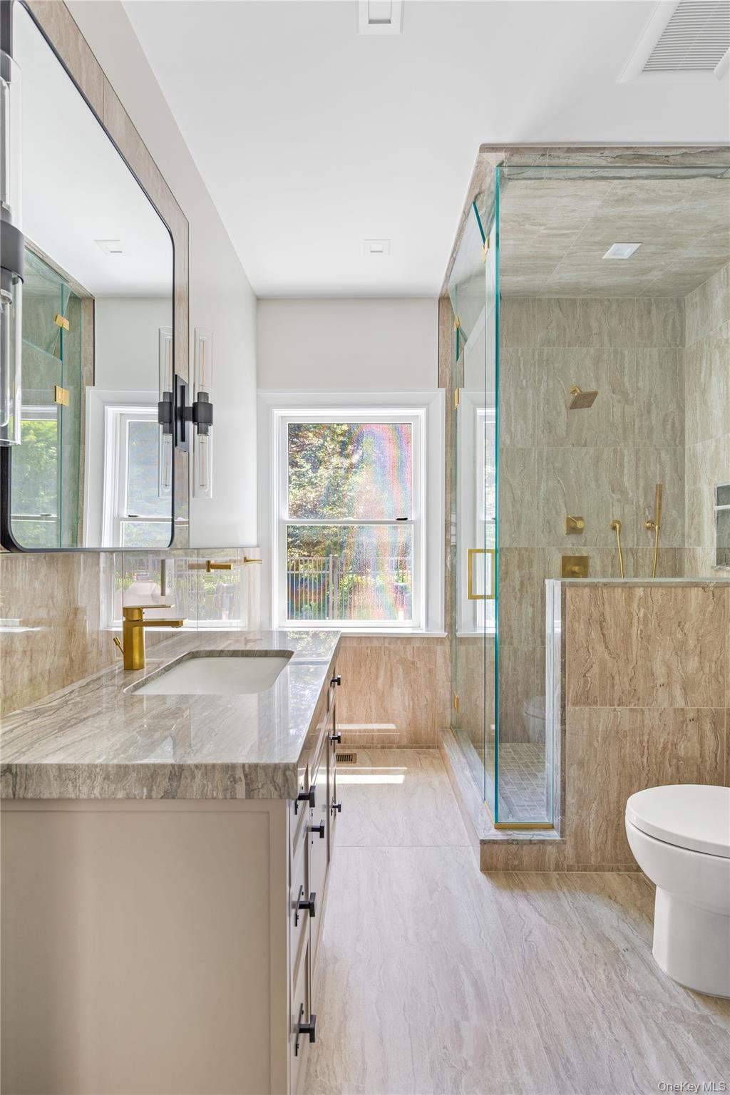 42 Mamaroneck Road Scarsdale, NY 10583 - Photo 25 of 47 A beautifully appointed full bath with a steam shower serves the indoor pool and adjoining flex space, offering comfort and convenience for family and guests alike.