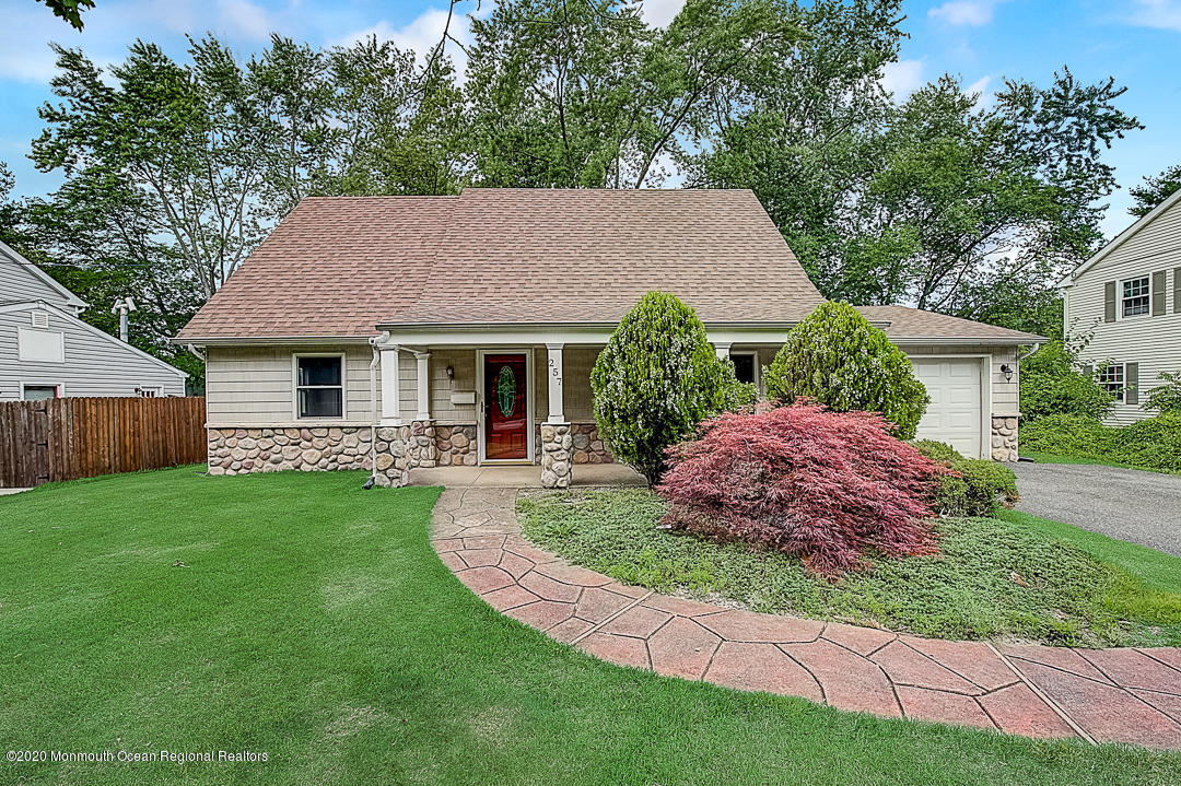 257 Lloyd Road Aberdeen, NJ 07747 - Photo 1 of 46 a front view of a house with garden
