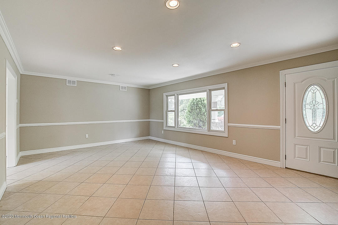 257 Lloyd Road Aberdeen, NJ 07747 - Photo 11 of 46 a view of an empty room with a window