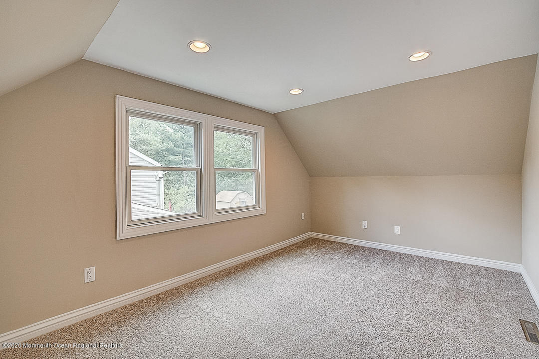 257 Lloyd Road Aberdeen, NJ 07747 - Photo 21 of 46 an empty room with a window