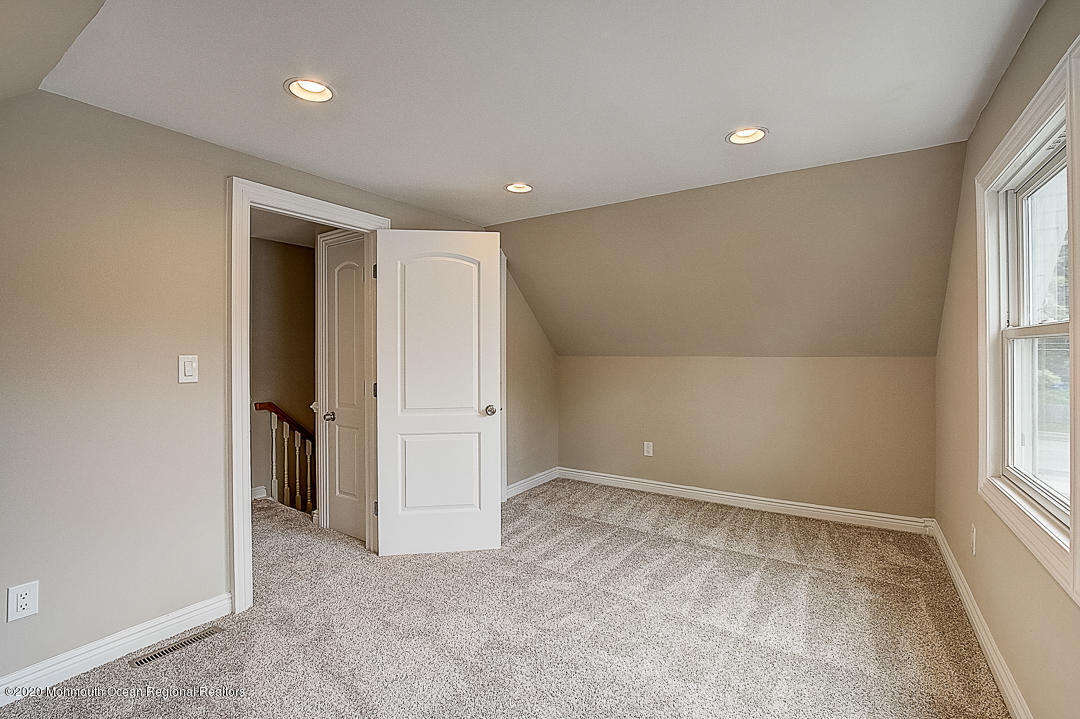 257 Lloyd Road Aberdeen, NJ 07747 - Photo 23 of 46 an empty room with windows and closet