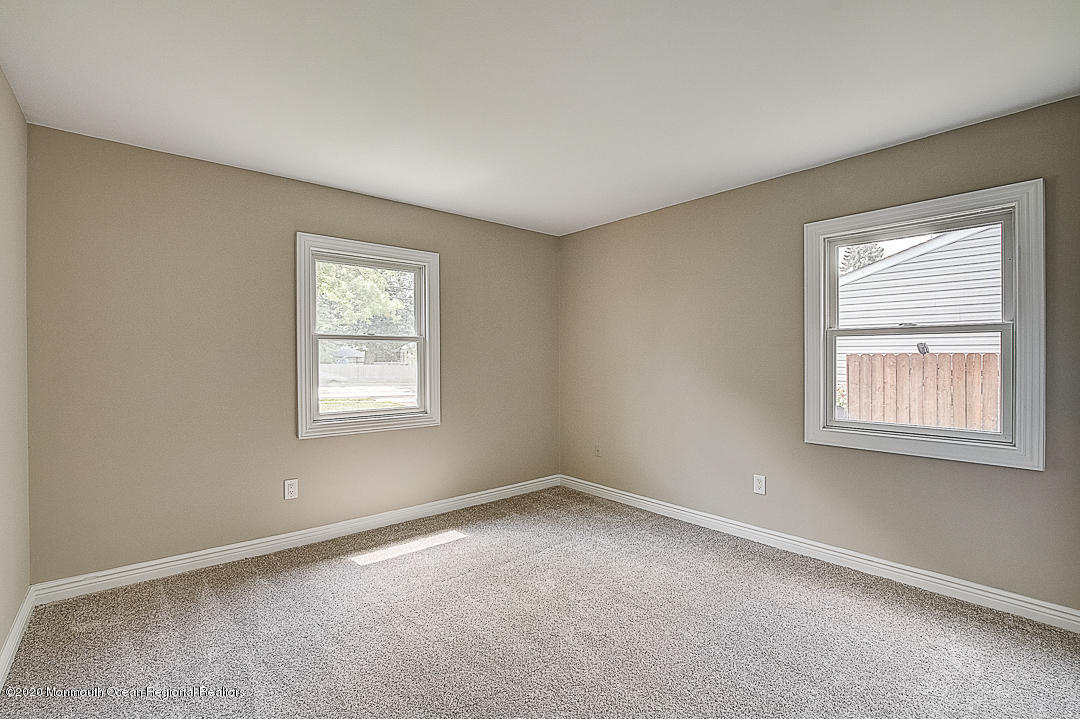 257 Lloyd Road Aberdeen, NJ 07747 - Photo 24 of 46 an empty room with a window