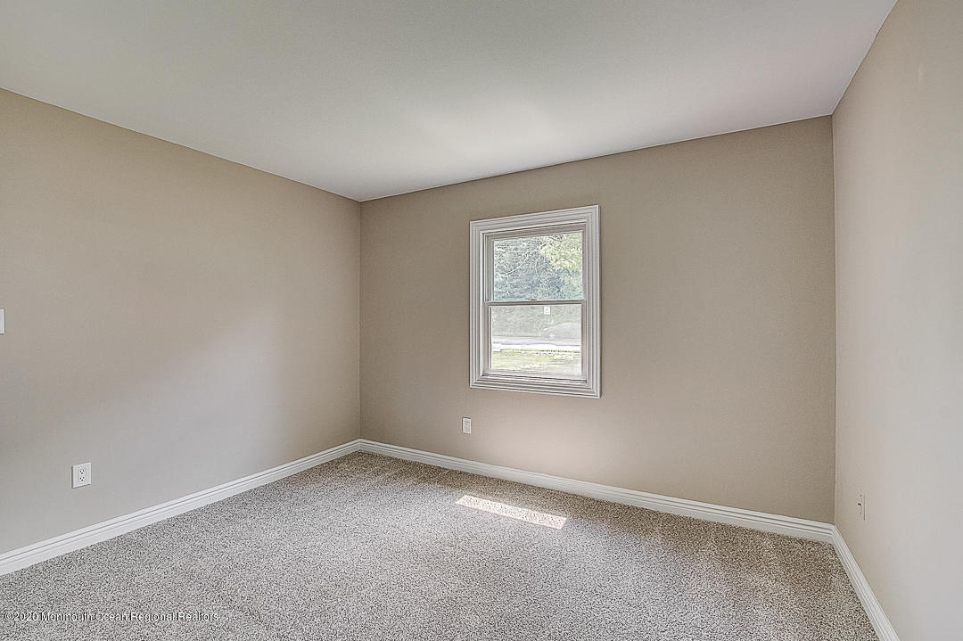 257 Lloyd Road Aberdeen, NJ 07747 - Photo 25 of 46 an empty room with a window