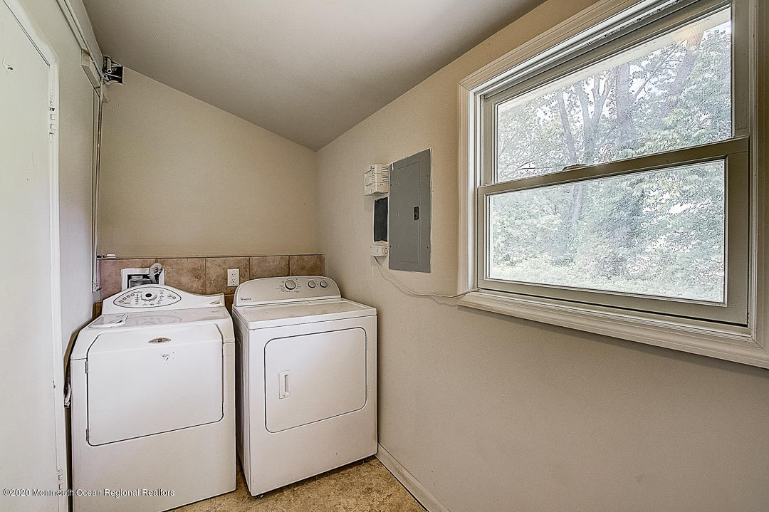 257 Lloyd Road Aberdeen, NJ 07747 - Photo 26 of 46 a utility room with dryer and washer