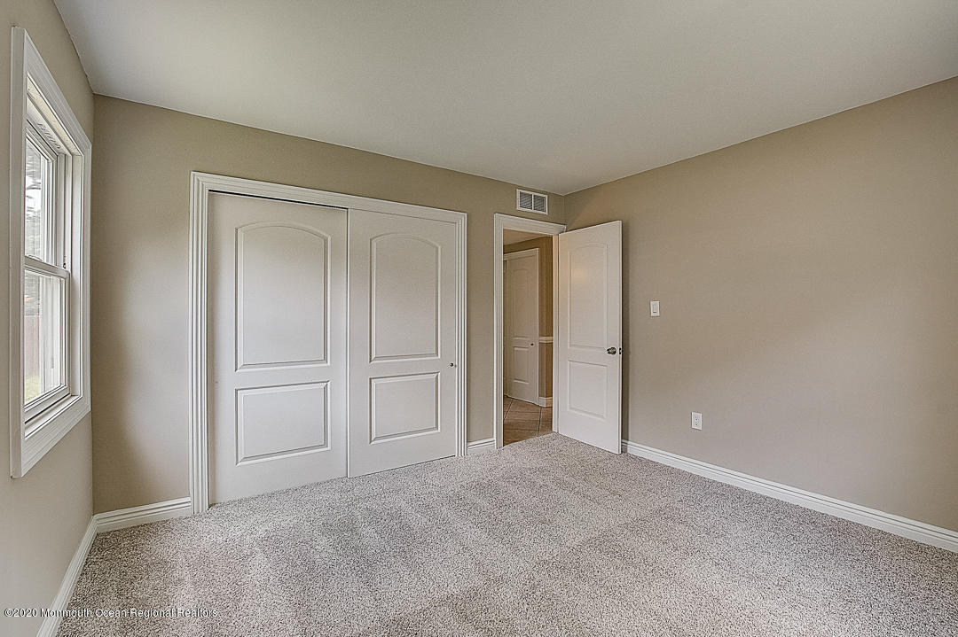 257 Lloyd Road Aberdeen, NJ 07747 - Photo 27 of 46 a view of an empty room and closet area