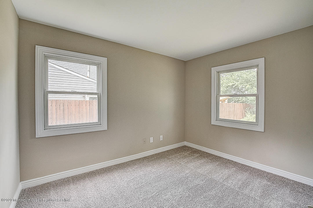 257 Lloyd Road Aberdeen, NJ 07747 - Photo 28 of 46 an empty room with a window